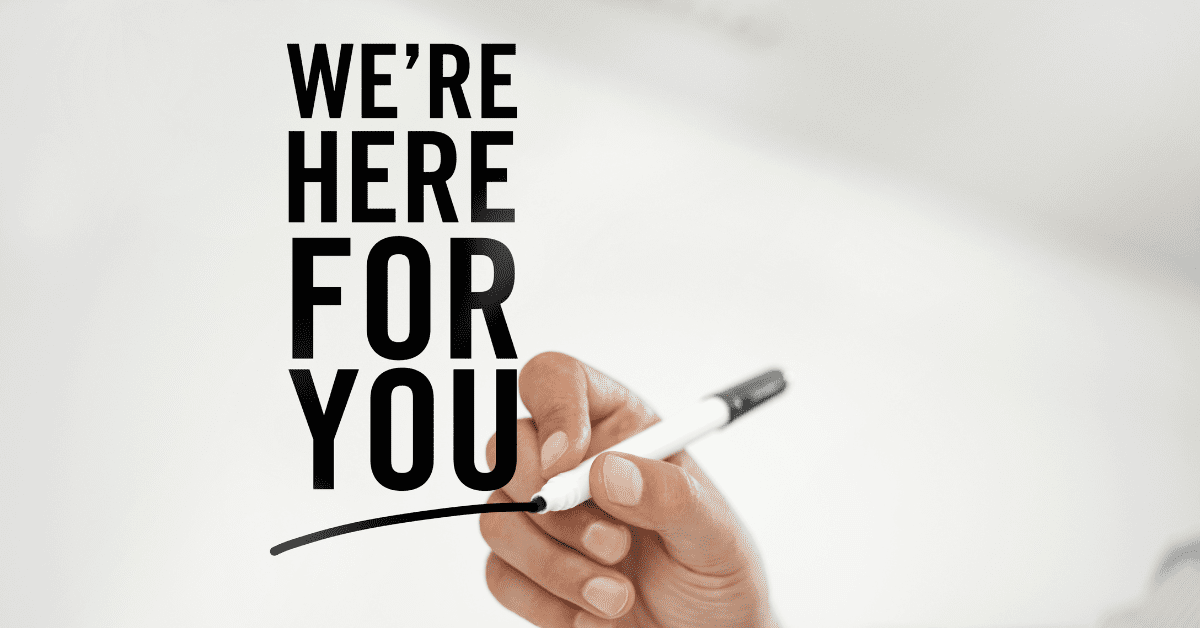 A close-up of a hand holding a black marker, drawing a line, with bold text next to it that reads "WE'RE HERE FOR YOU. Lightning protection solutions
